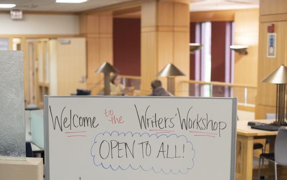 photo of the Workshop space with a whiteboard featuring a Welcome message